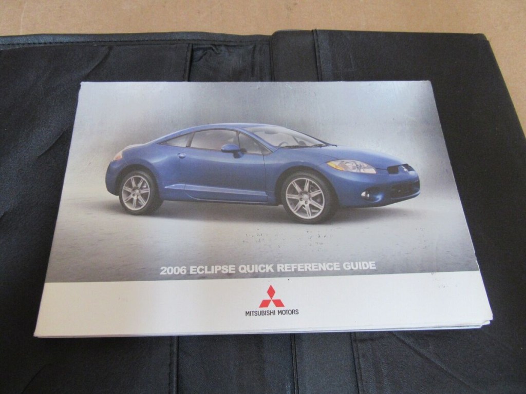 Picture of: Mitsubishi Eclipse Owners Manual Book Set W/ Case OEM Free Shipping
