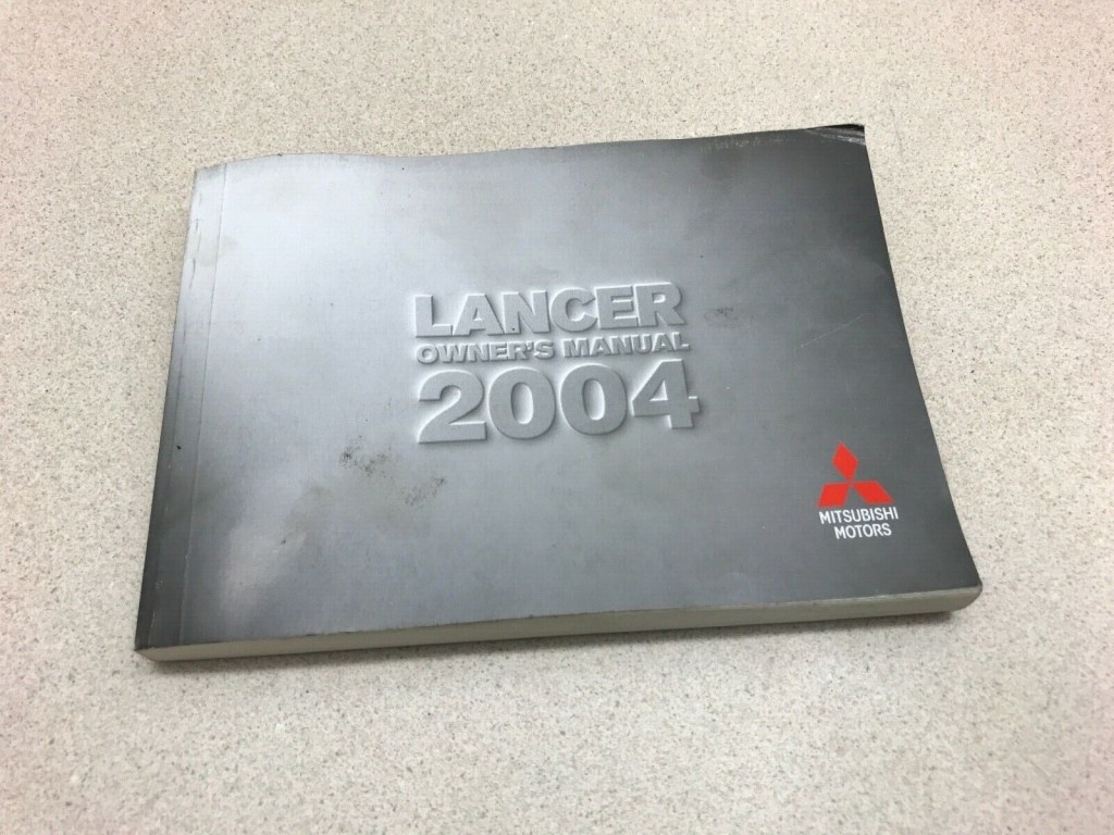 Picture of: Mitsubishi Lancer Owner’s Manual Book OEM Factory